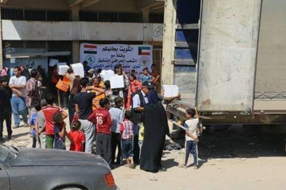 "الكويت بجانبكم" توزع دفعة جديدة من المساعدات لنازحي الموصل  